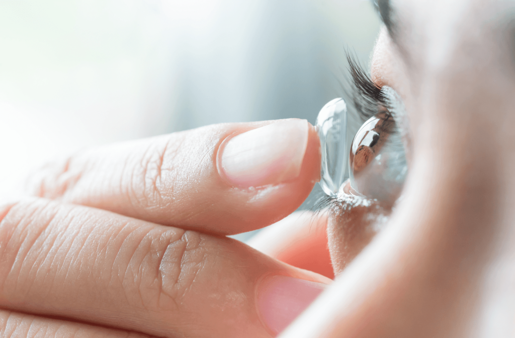 Woman putting in contacts